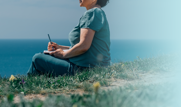 Woman Journaling Outdoors representing Mindfulness Self-Compassion